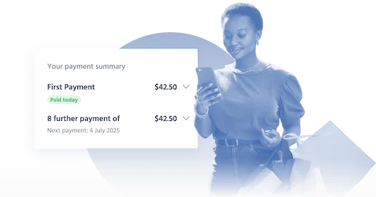 A woman smiling and holding a phone with a payment summary showing the first payment made and the next installment scheduled