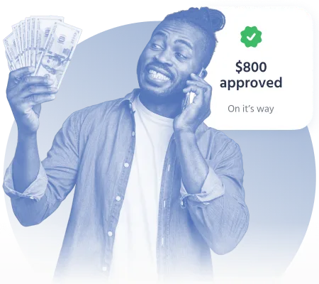 Happy man holding cash and talking on the phone after $800 loan approval
