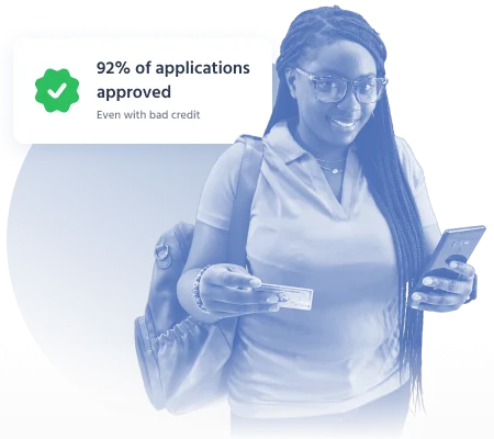 Woman checking loan approval on smartphone – 92% of guaranteed loan applications approved