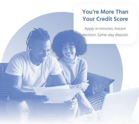 Couple reviewing second chance loan approval at home