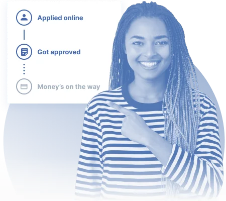 Smiling woman pointing at an online $500 loan approval with same-day funding from a direct lender